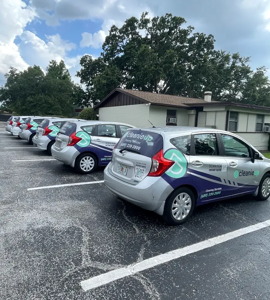 Row of branded CleanieUp cleaning cars ready for the day's house cleanings around Winter Garden, FL Row of branded CleanieUp cleaning cars ready for the day's house cleanings around Winter Garden, FL